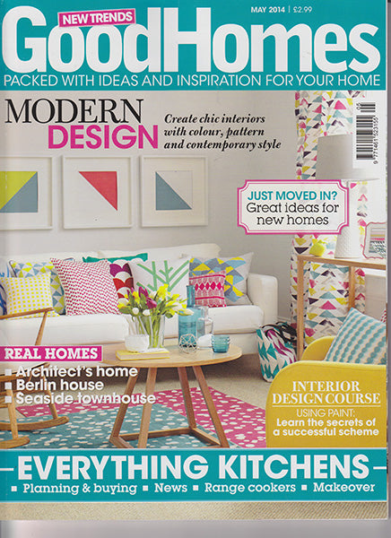 étoile home's London polka dot, Bunting and Huts tiki pattern throw pillows on the cover of Good Homes Magazine. 
