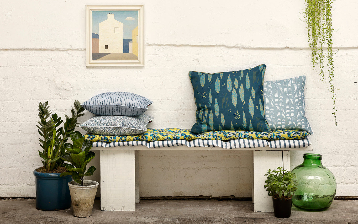 Decorative throw pillows in shades of blue from pale to dark petrol and bright turquoise in patterns and stripes. Ships from Canada worldwide including the USA