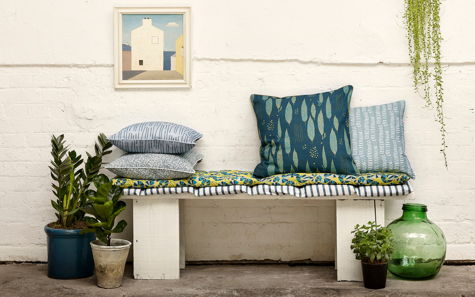 Decorative throw pillows in shades of blue from pale to dark petrol and bright turquoise in patterns and stripes. Ships from Canada worldwide including the USA