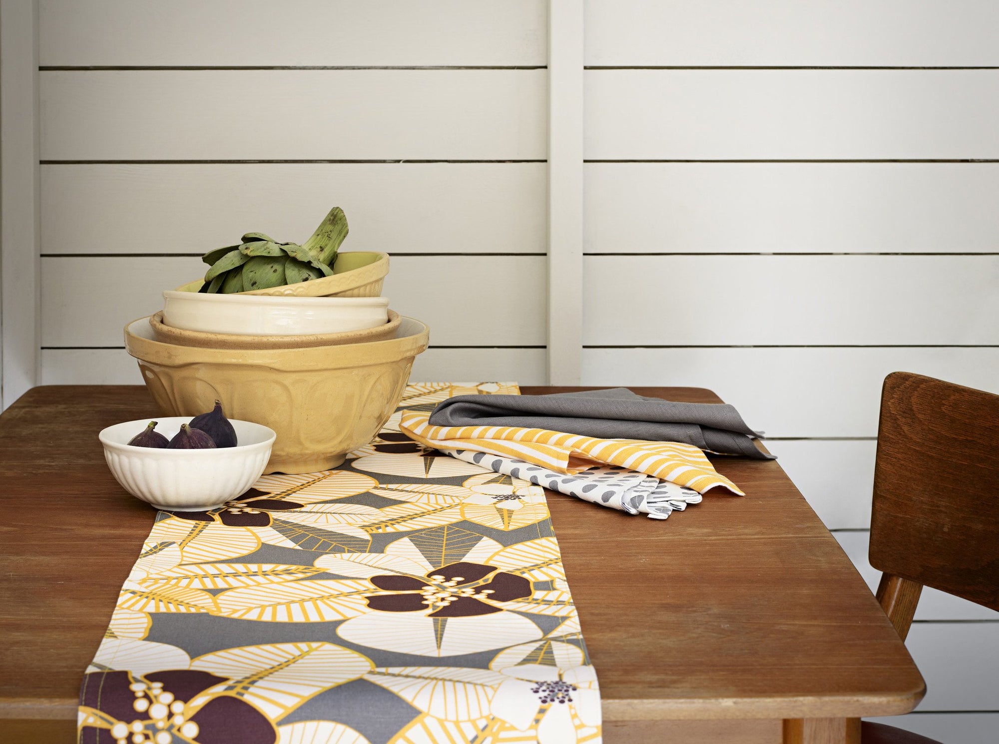 Cotton linen tablecloths, napkins and table runners in bold, modern patterns and stripes in shades of yellow. Ships from Canada worldwide including the USA