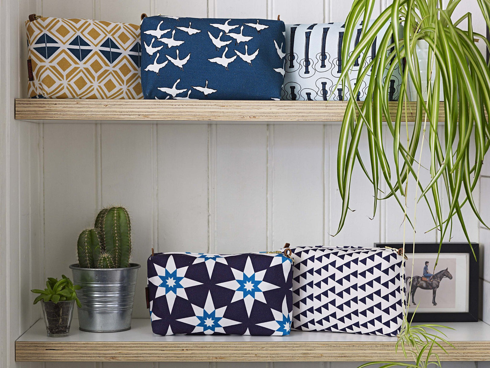 Printed cotton canvas toiletry travel bags for all your cosmetics. Stain and water resistant with waterproof lining. With metal zips and leather trim. Handmade in the UK ships from Canada worldwide including the USA