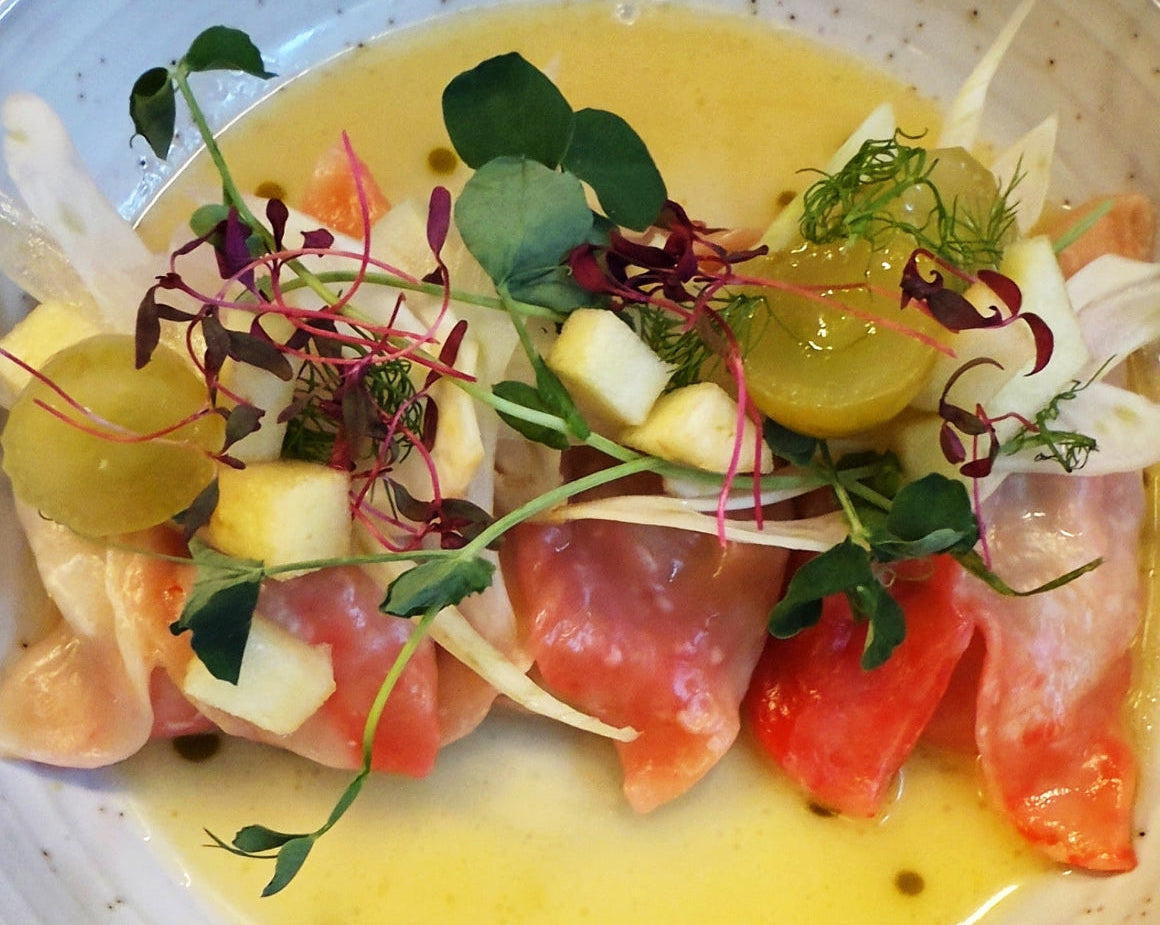 CRab  & fennel dumplings with micro greens, fennel and pickled grapes
